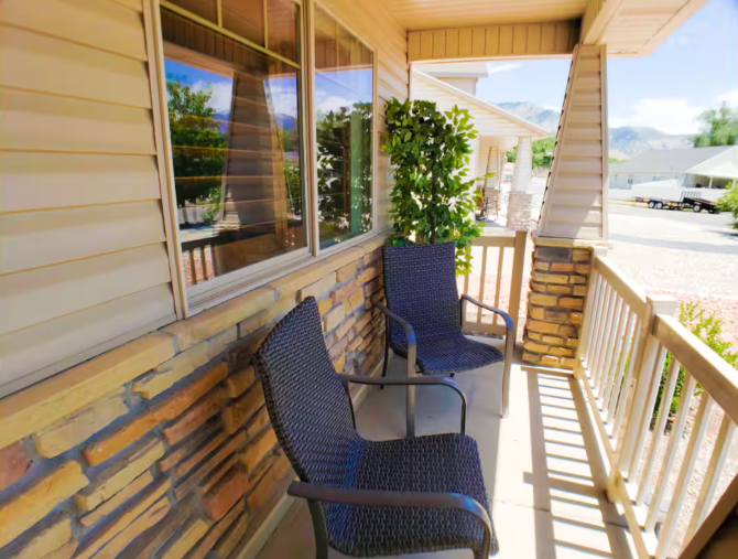Covered porch with seating and mountain view