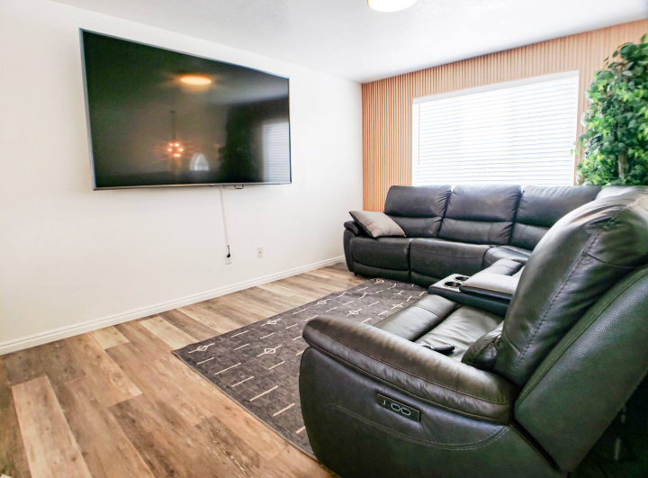 Open concept living room with comfortable seating and natural light