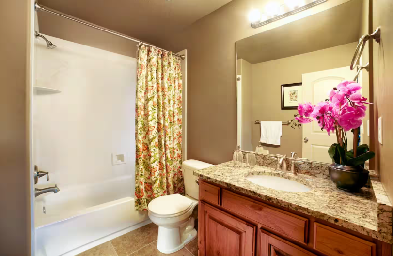 Second full bathroom with tub, shower and granite countertop