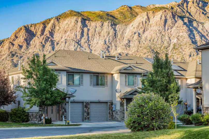 Townhome exterior with dramatic Wasatch Mountain backdrop