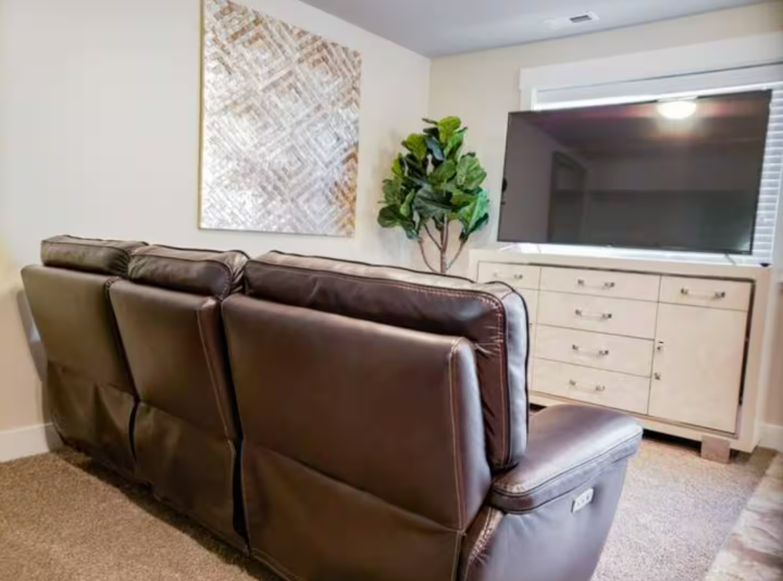 Living room with leather sofa, Smart TV and modern decor