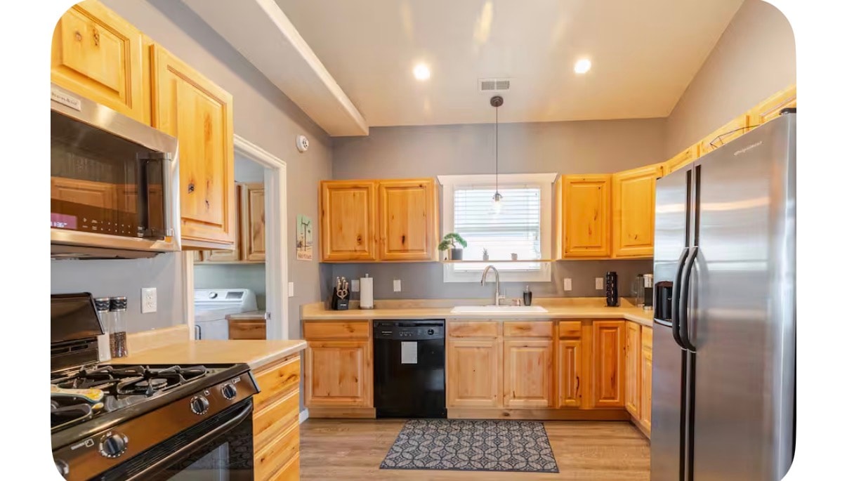 Modern well-equipped kitchen with open floor plan