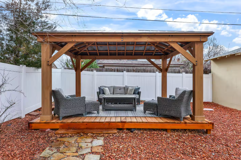 Cedar gazebo with wicker seating on deck
